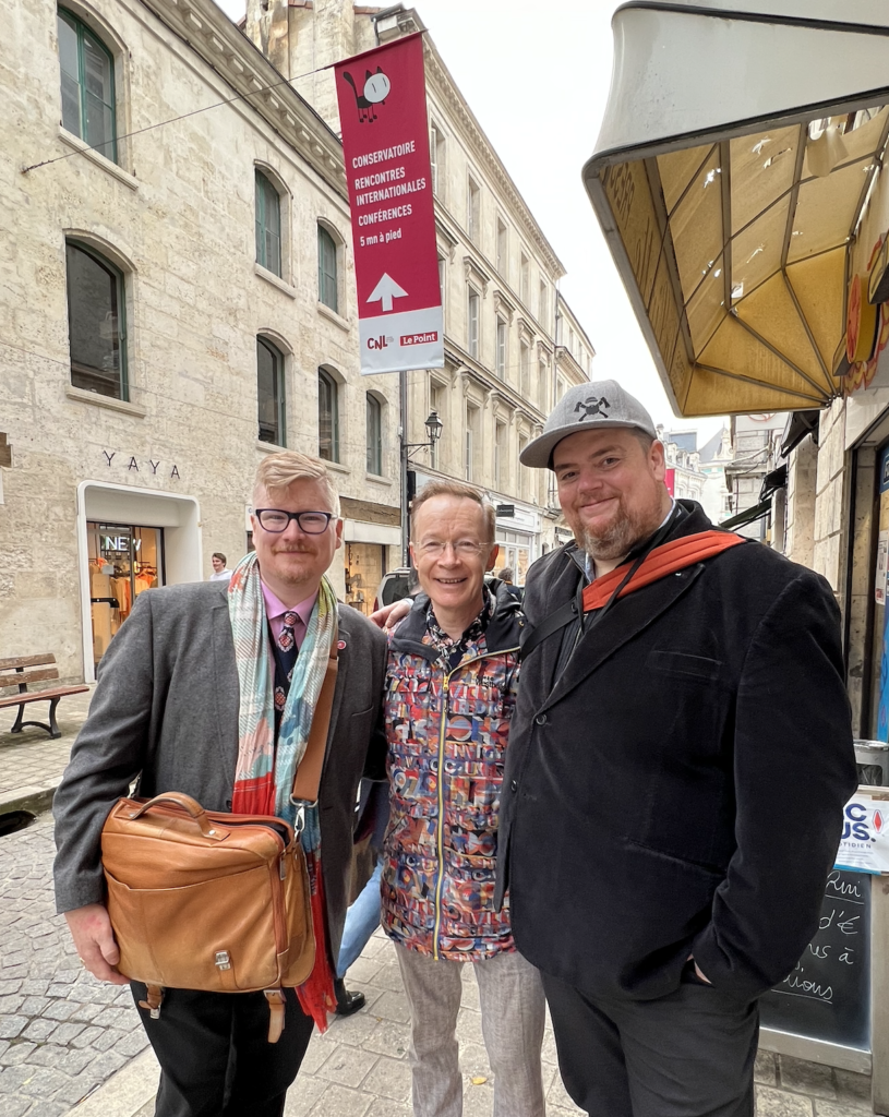 Andrew Woodrow-Butcher, Paul Gravett and Christopher Woodrow-Butcher at Angouleme 2022